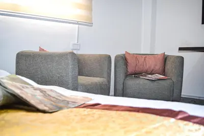 a living room with a couch and a chair at Hikaya studios in Wadi Musa