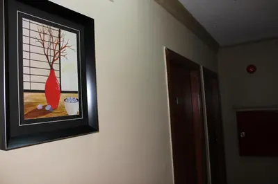 a framed picture of a vase on a wall at Baraka Al Aqaba Hotel Suites in Aqaba