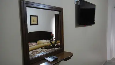 a mirror on a table in a room at Baraka Al Aqaba Hotel Suites in Aqaba