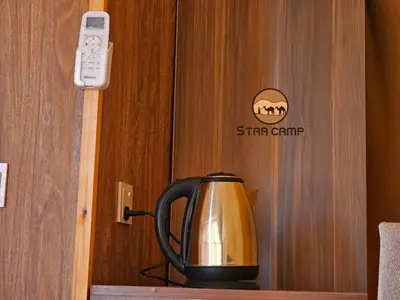 a tea kettle sitting on a shelf next to a door at Star Camp in Wadi Rum