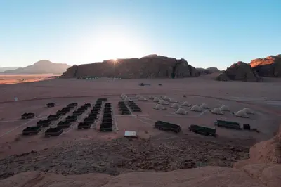 a parking lot in the middle of a desert at SunCity Camp in Wadi Rum