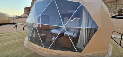 a tent with a bed inside of it at Montana Camp wadi rum in Wadi Rum