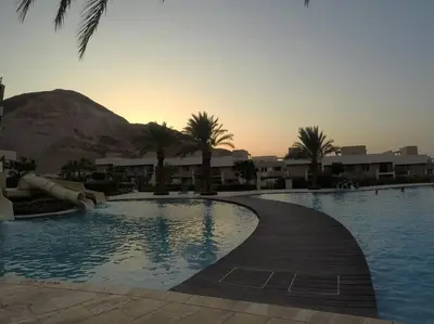 a swimming pool with a slide in a resort at Rental unit in RAHA village compound, special view in Aqaba