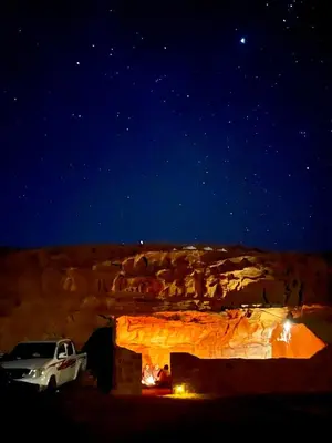 a car parked in a cave at night at Wadi Rum Trail in Wadi Rum