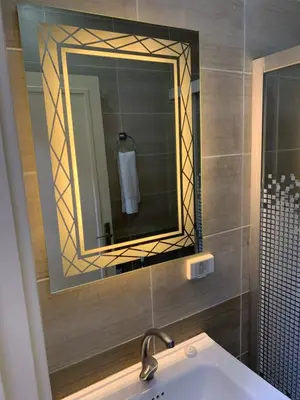 a bathroom with a sink and a mirror at Asad Apt. in Wadi Musa