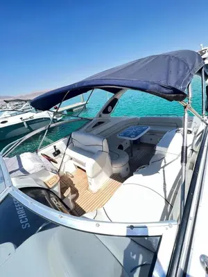 a boat sitting on top of the water at Roza Beach Aqaba in Aqaba