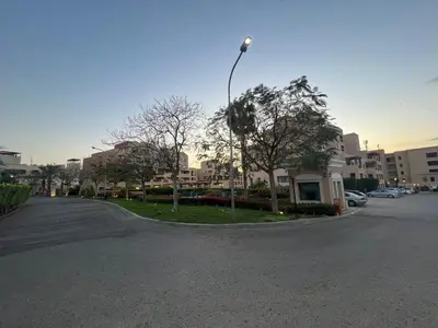 a street with a street light on the side of a road at Spacious apartments with Sea view at Samarah Resort in Sowayma