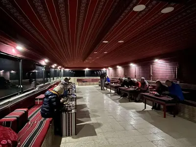 a group of people sitting in a waiting room at Bedouins nights in Wadi Rum