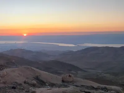 a sunset from the top of a mountain at private room with cultural experience and great landscapes in Şirfah