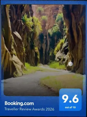 a picture of a painting of a road in a canyon at Maria Home in Madaba