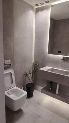 a bathroom with a white toilet and a sink at Rooftop one room غرفه نوم فقط in Amman