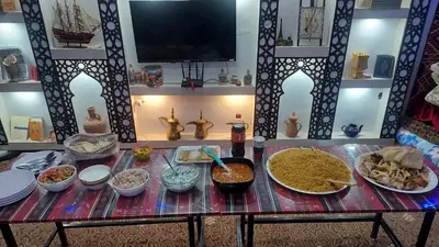 a table with many different dishes of food on it at Wadi Rum Oryx Hostel & Tours in Wadi Rum