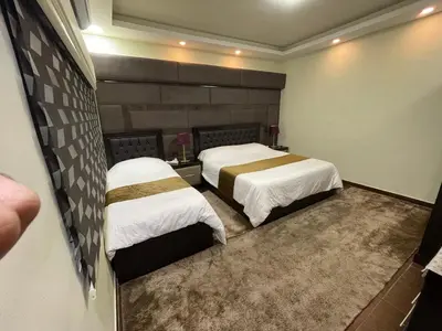 a hotel room with two beds in a room at Oqdeh studio in Jerash