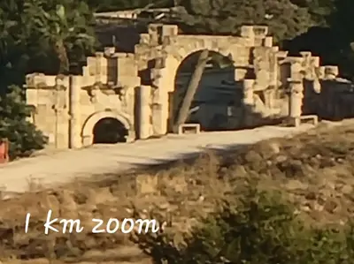 an old stone building with a tunnel in the background at atoom lodge in Jerash