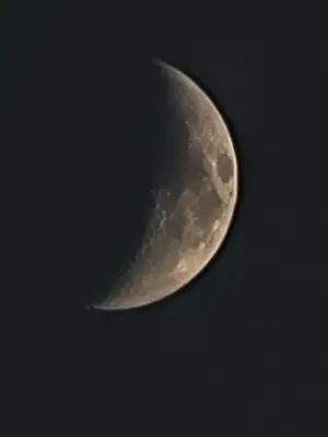a half moon in the sky at atoom lodge in Jerash