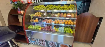 a refrigerator filled with lots of fruits and vegetables at Hadrian's Arch in Jerash