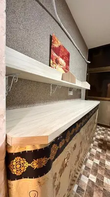 a shelf in a room with wooden shelves at Authentic boutique in Wadi Musa