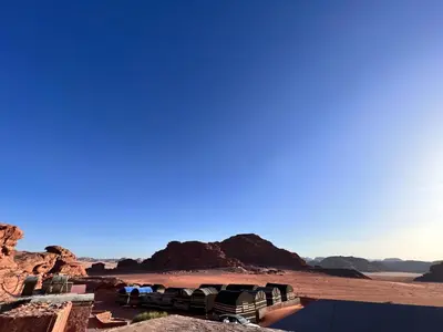 a view of a desert with mountains in the background at Wadirum Zeid Classic camp in Wadi Rum