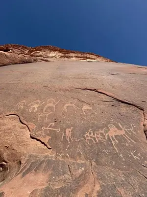 a painting of horses on a rock in the desert at Enad desert camp in Wadi Rum