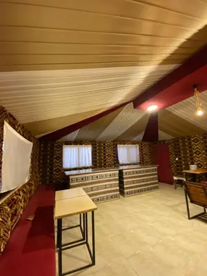 a room in a tent with a table and chairs at Wadi Rum beautiful time in Wadi Rum