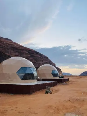 two domes in the middle of a desert at Wadi Rum beautiful time in Wadi Rum