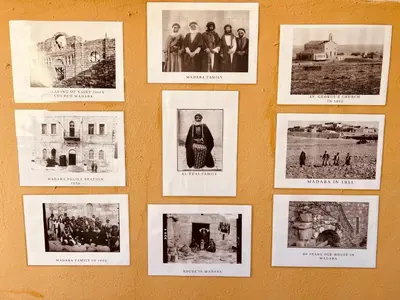 a wall with pictures of people on a wall at IBN Khaldoon in Madaba