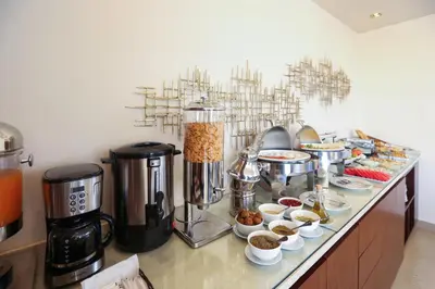 a buffet of food on a counter in a kitchen at Khuttar Apartment in Amman