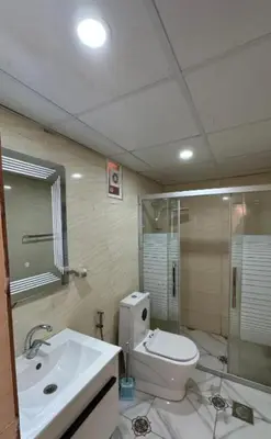 a bathroom with a toilet and a sink and a shower at Star Magic Camp in Wadi Rum