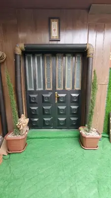 two potted plants sitting in front of a door at petra Casablanca lodge in Wadi Musa