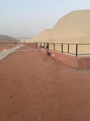 a row of domed buildings on the beach at Jawharat Rum camp in Wadi Rum