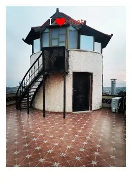 a building with a heart sign on top of it at Top 