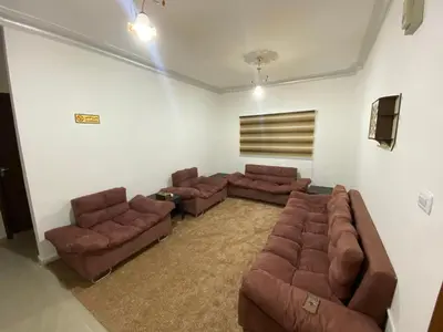 a living room with two couches and two chairs at Hustle's look in Wadi Musa