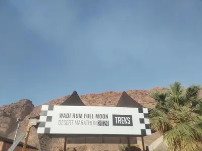 a sign for the wollywoodrum full moon festival interpretation zoo at Rum desert camp in Wadi Rum
