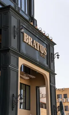 a sign on the front of a brussels hotel at Bratus Hotel in Aqaba