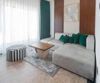 a living room with a couch and a table at Bratus Hotel in Aqaba