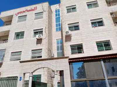 a brick building with an arch in front of it at Al-Shokhaibie 51 Building- Soufan Studios in Ţāb Kirā‘