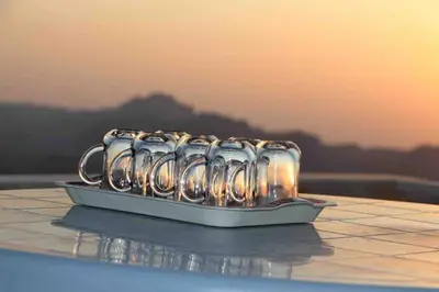 a tray of mugs sitting on top of a table at Cozy House in Wadi Musa