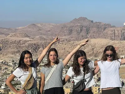 a group of women standing in front of a mountain at Cozy House in Wadi Musa