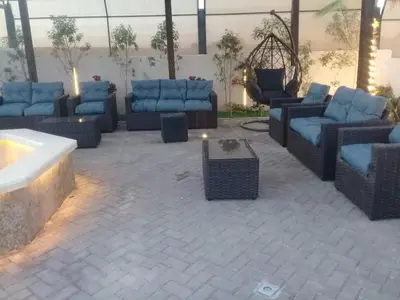 a group of blue couches in a room at The royal cottage Amman in Al Qasţal