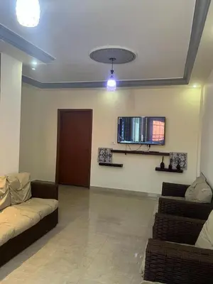 a living room with two couches and a ceiling at Petra Inn House in Wadi Musa