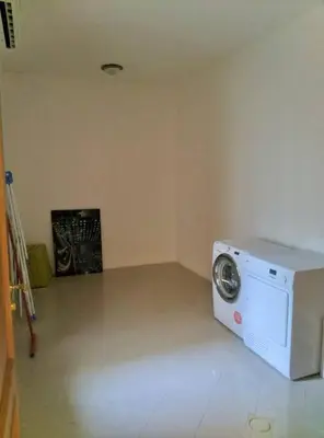 a kitchen with a washing machine in a room at Contemporary Semi Villa Apartment with Private Entrance in Khalda in Amman