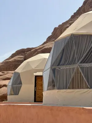 two domes in the middle of a desert at Anwar Al Qamar Luxury Hotel in Wadi Rum