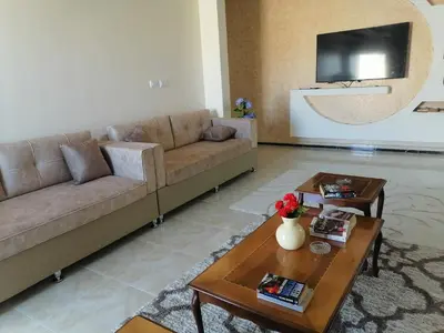 a living room with a couch and a table at Petra Guests home in Wadi Musa