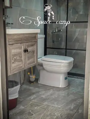 a bathroom with a toilet and a sink at Wadi Rum Space camp in Wadi Rum