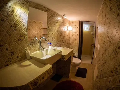 a bathroom with a sink and a toilet at Shams House in Amman