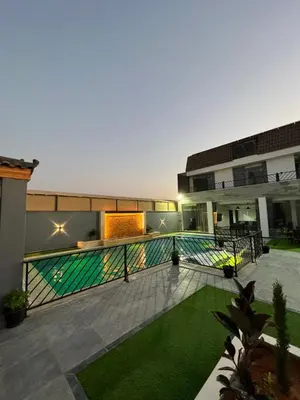 a courtyard of a building with a swimming pool at Aroma Mountain Dead Sea in Sowayma