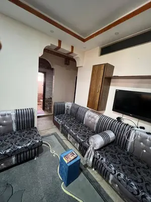a living room with couches and a flat screen tv at Petra luxurious view house in Wadi Musa