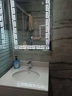 a bathroom with a sink and a mirror at Villa Jana chalet - Private Villa - Dead Sea - Jordan in Ash Shāghūr