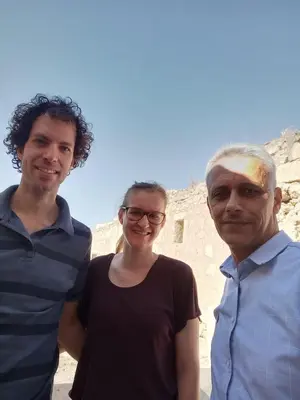 two men and a woman standing next to each other at شقة سيلا in Irbid