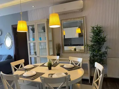 a dining room with a table and chairs at Ritala Royal Residence in Amman